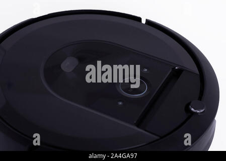 Robotic vacuum cleaner isolated on white background. New technology concept. Stock Photo