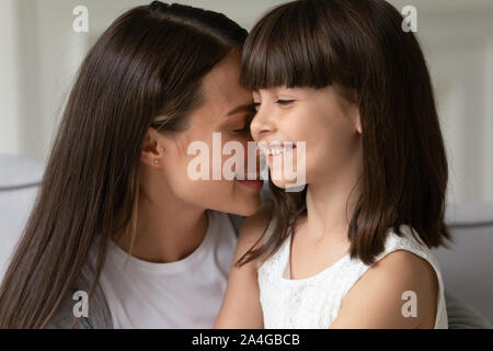 Head shot close up happy young mother bonding little daughter. Stock Photo