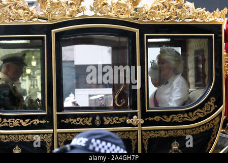 London, UK. 14th Oct, 2019. Camilla (Duchess of Cornwall), accompanies Queen Elizabeth II in the Diamond Jubilee State Coach, at The state opening of Parliament, where Queen Elizabeth II delivers the Queen's Speech (written by the government). Members of the armed forces line the route to the Palace of Westminster, London, UK on October 14, 2019. Credit: Paul Marriott/Alamy Live News Stock Photo