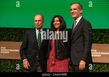 COPENHAGEN, DENMARK -  OCTOBER 10, 2019: Michael Bloomberg (L), Anne Hidalgo, Mayor of Paris and Eric Garcetti (R), Mayor of Los Angeles, at the C40 World Mayors Summit 2019  hand-over of the Chair in Copenhagen. More than 70 mayors of some of the world’s largest and most influential cities representing some 700 million people meet in Copenhagen from October 9-12 for the C40 World Mayors Summit. The purpose with the summit in Copenhagen is to build a global coalition of leading cities, businesses and citizens that rallies around radical and ambitious climate action. Also youth leaders from the