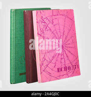 Year Books from Jasper Place and Daniel McIntyre High schools as well as a Year Book from Red Deer River College. Placed on a white background. Stock Photo