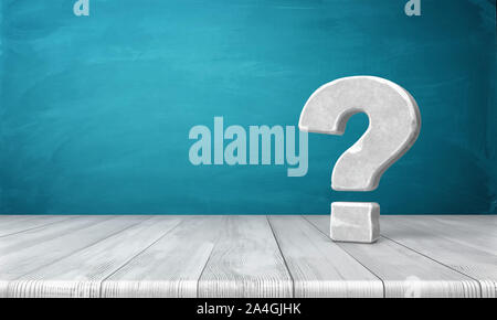 3d rendering of a grey-white question mark made of stone standing on a wooden table on blue background. Stock Photo