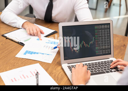 Brokers work in the office. Investments, multiplication of profits, finances concept Stock Photo