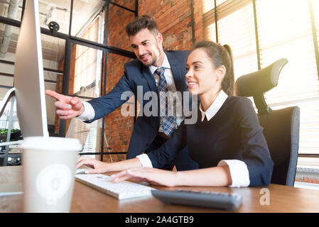 Team business couple working in office. Cooperation and co-working concept Stock Photo