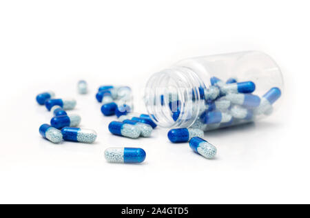 Pile of spilled capsules on a white background. Pharmacy concept Stock Photo