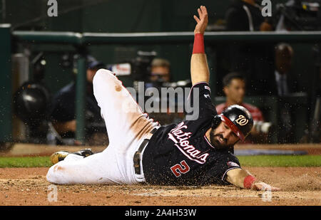 Washington, United States. 14th Oct, 2019. Washington Nationals' Adam Eaton (2) scores against the St. Louis Cardinals on an RBI double by Anthony Rendon during the third inning of game 3 in the NLCS at Nationals Park in Washington, DC, on Monday, October 14, 2019. Photo by Kevin Dietsch/UPI Credit: UPI/Alamy Live News Stock Photo