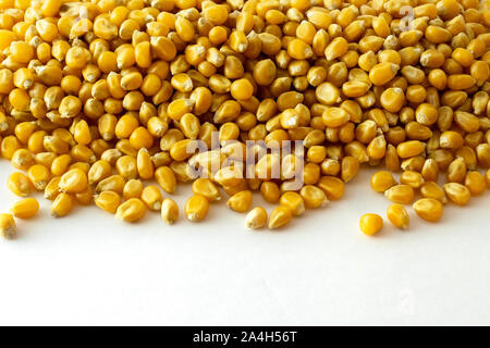 a group of dried corn kernels on white background Stock Photo