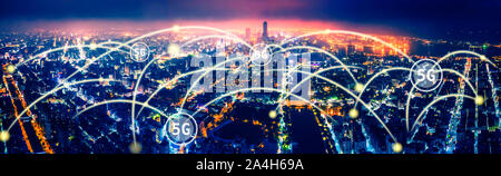 aerial view city at  night  and 5g network  tech concepts Stock Photo