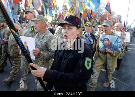 Kiev, Ukraine. 14th Oct, 2019. Ukrainian veterans who participated at the war conflict with pro-Russian separatist during the march commemorating the 77th anniversary of the founding of the UPA.The Ukrainian Insurgent Army (UPA) active fought for Ukrainian independence from 1942 to 1949, mostly in Western Ukraine against the German Nazi and Soviet regimes. Ukrainians also mark the Defender of Ukraine Day on the same date. Credit: SOPA Images Limited/Alamy Live News Stock Photo