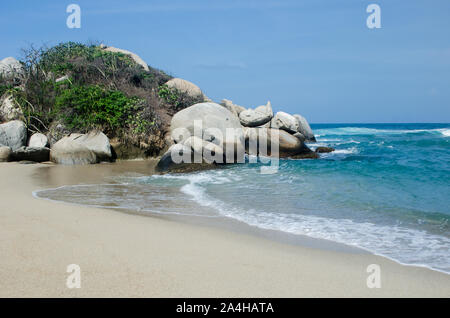 Beautiful sandy beach and rocky landscape in Tayrona National Park, a protected area located in Magdalena Department on the Caribbean Side of Colombia Stock Photo