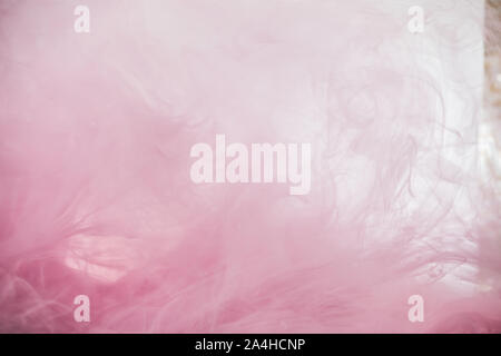 Pink smoke colorful abstract background, Liquid dynamic paint splash in water, pink acrylic ink mixing in water Stock Photo