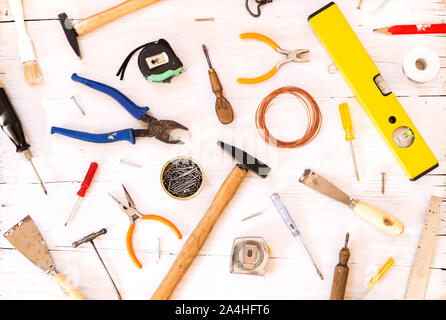 Tools collection on white wooden background Stock Photo