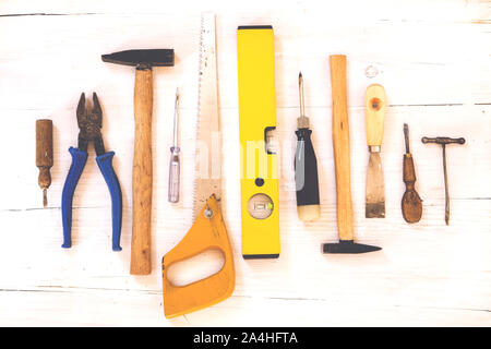 Tools collection on white wooden background Stock Photo