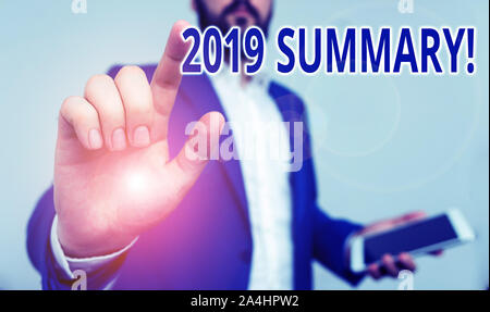 Conceptual hand writing showing 2019 Summary. Concept meaning summarizing past year events main actions or good shows Businessman pointing with pen in Stock Photo