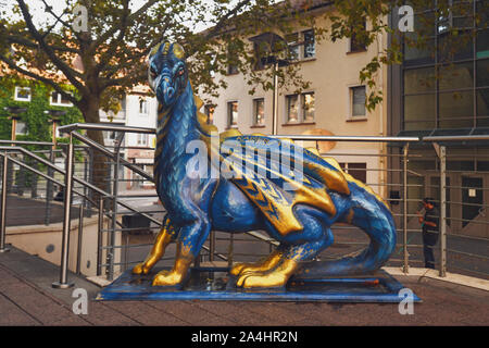 Worms, Germany - October 2019: Sculpture of a blue 'Lindworm' dragon, inaccurately depicted with wings, in city center of Worms Stock Photo