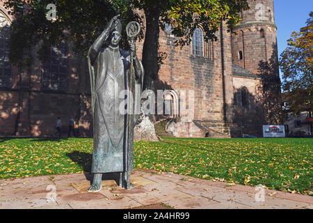 Worms, Germany - October 2019: Metal scupture of bishop Burchard of Worms, author of a canon law collection of twenty books known as the 'Decretum' Stock Photo