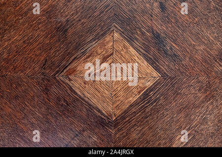 texture background old furniture dark wood with a lighter, square shaped inlay Stock Photo