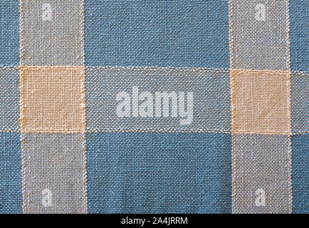 texture woven cotton fabric blue and wheat colored stripes and checkers Stock Photo