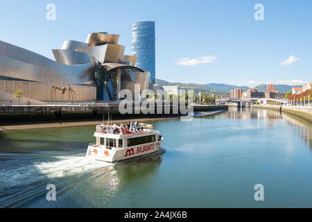 Bilbao river cruise boat on the Nervion river passing the Guggenheim Museum, Bilbao, Basque Country, Spain, Europe Stock Photo