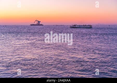 Sunset over the Venice lagoon with a ferry Stock Photo - Alamy