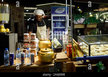 DUBAI, UAE, JANUARY 09, 2019: Street food seller on the area of the Dubai Parks Stock Photo