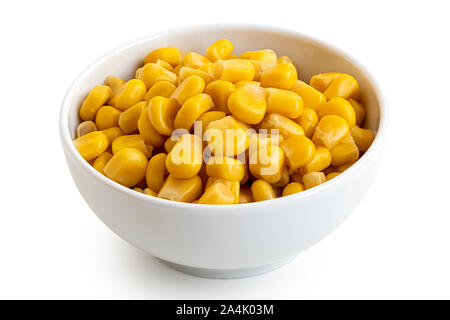 Canned sweet corn in a white ceramic bowl isolated on white. Stock Photo