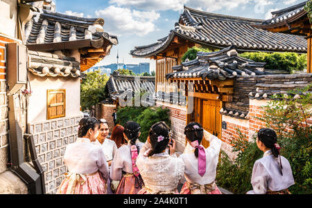 Seoul Korea , 23 September 2019 : Group of Asian tourists girls in traditional Korean Hanbok dressing at Bukchon Hanok village in Seoul South Korea Stock Photo