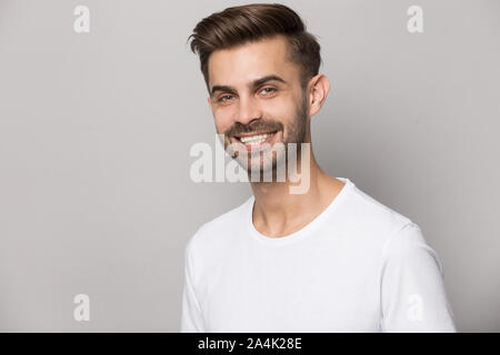Headshot portrait of smiling caucasian man posing in studio Stock Photo