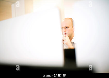 Young man in workplace Stock Photo