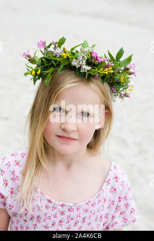 Portrait of Girl Wearing Crown of Wildflowers - wreath Stock Photo