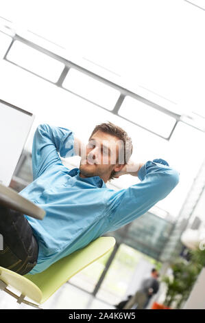 Young man in workplace Stock Photo