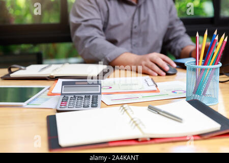 Small and Medium Enterprise Business concept of Close up calculator on office desk Stock Photo