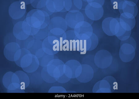 Beautiful abstract lights on blue backdrop. Blurred, bokeh, defocused. Stock Photo