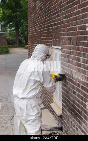 Craftsman flexing on the wall industy Stock Photo