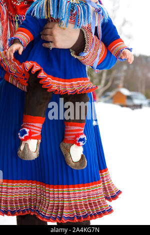 Laplander mother and child in traditional costume. Mother and child. Lapp / Lapps / Laplander / Laplanders / Lapplander / Lapplanders / Sami / Same in Stock Photo