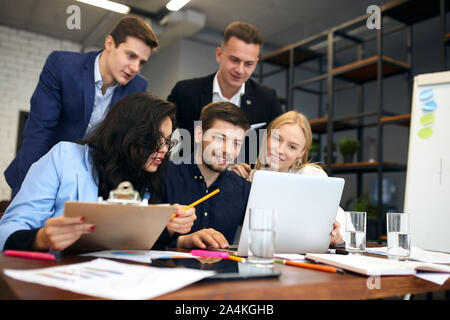 young ambitious business people sharing ideas, plans of new project, close up photo.teamwork Stock Photo