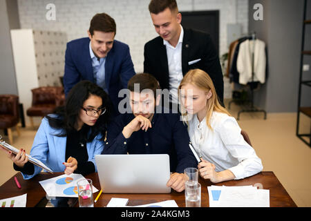 young office workers surfing, browsing the net, having video session with clients, online consultation. close up photo Stock Photo