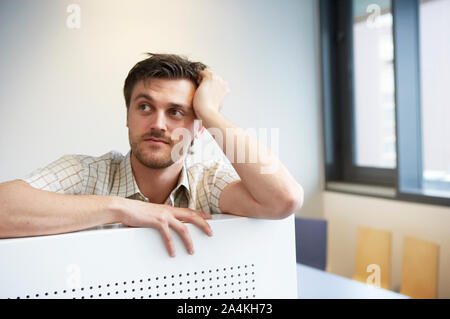 Young man in workplace Stock Photo