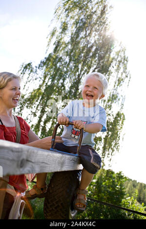Child on teeter-totter Stock Photo