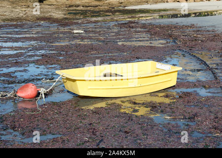 Boat tender on sand at low tide in an harbor in Brittany Stock Photo