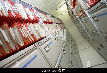 alphabetical order - alphabeth - in a row - filing documents - files- research - bureaucracy - storage room historical order confirmity - paperwork - Stock Photo