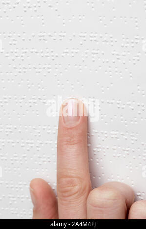 Blind person reading braille Stock Photo
