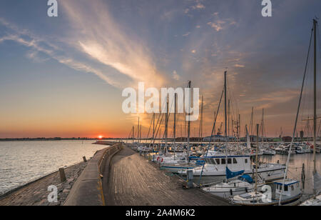Sunset and sailboats at the harbour and pier in Varberg, Halland, Sweden, Scandinavia. Stock Photo