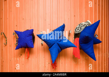 Laplander hats hanging on wall. Lapp / Lapps / Laplander / Laplanders / Lapplander / Lapplanders / Sami / Same in Karasjok, Lapland / Lappland. Stock Photo