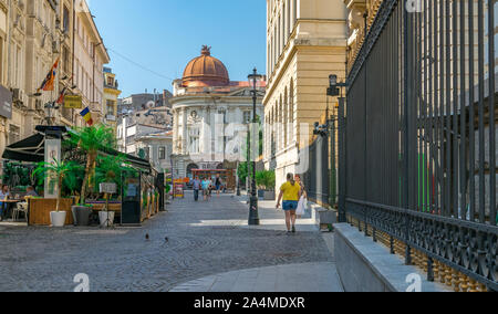 BUCHAREST, ROMANIA - 27 JULY, 2019: People walking on a sunny summer day in the historic center of Bucharest, Romania. Beautiful morning in the histor Stock Photo