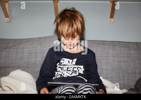 Boy using digital tablet Stock Photo