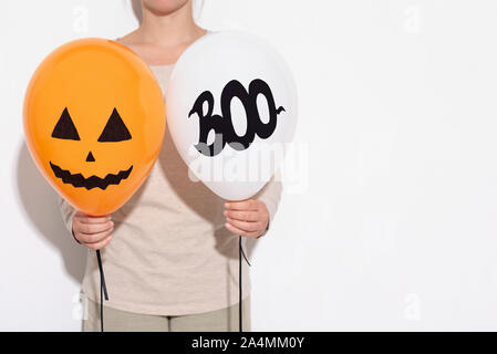 Woman holding Creative party balloons on white Stock Photo