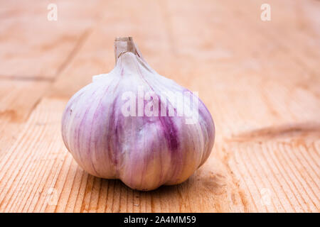 head of garlic on wooden table, closeup Stock Photo
