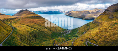 Aerial panorama of mountains around village of Funningur on Faroe Islands