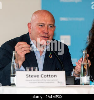 COPENHAGEN, DENMARK – OCTOBER 09, 2019: Steve Cotton, General Secretary of the International Transport Workers Federation, speaks during the C40 World Mayors Summit opening press conference at Copenhagen City Hall. More than 90 mayors of some of the world’s largest and most influential cities representing some 700 million people meet in Copenhagen from October 9-12 for the C40 World Mayors Summit. The purpose with the summit in Copenhagen is to build a global coalition of leading cities, businesses and citizens that rallies around radical and ambitious climate action. Also youth leaders from t